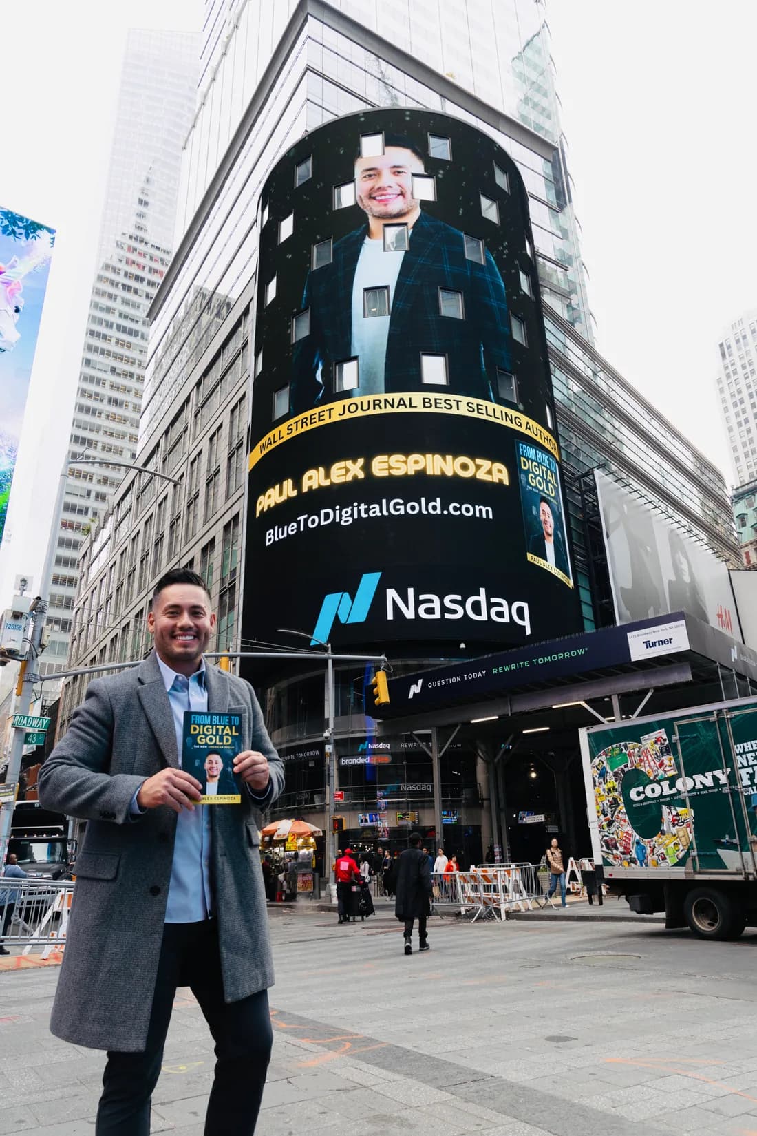 Paul Alex holding From Blue to Digital Gold in Times Square